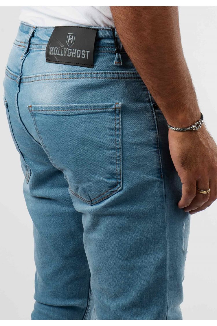 Jean délavé bleu avec trous